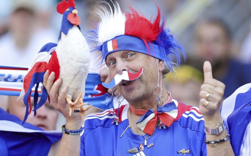 firo : 25.06.2024, Football, Soccer: UEFA EURO 2024, EM, European Championship 2024, Group Stage, M32, Match 32 FRA, France - POL, Poland Fans of France Fan of France (Photo by Ralf Ibing / firo Sportphoto / dpa Picture-Alliance via AFP)
