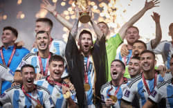 LUSAIL CITY, QATAR - DECEMBER 18: Lionel Messi of Argentina lifts the FIFA World Cup Qatar 2022 Winner’s Trophy during the FIFA World Cup Qatar 2022 Final match between Argentina and France at Lusail Stadium on December 18, 2022 in Lusail City, Qatar. (Photo by Julian Finney/Getty Images)