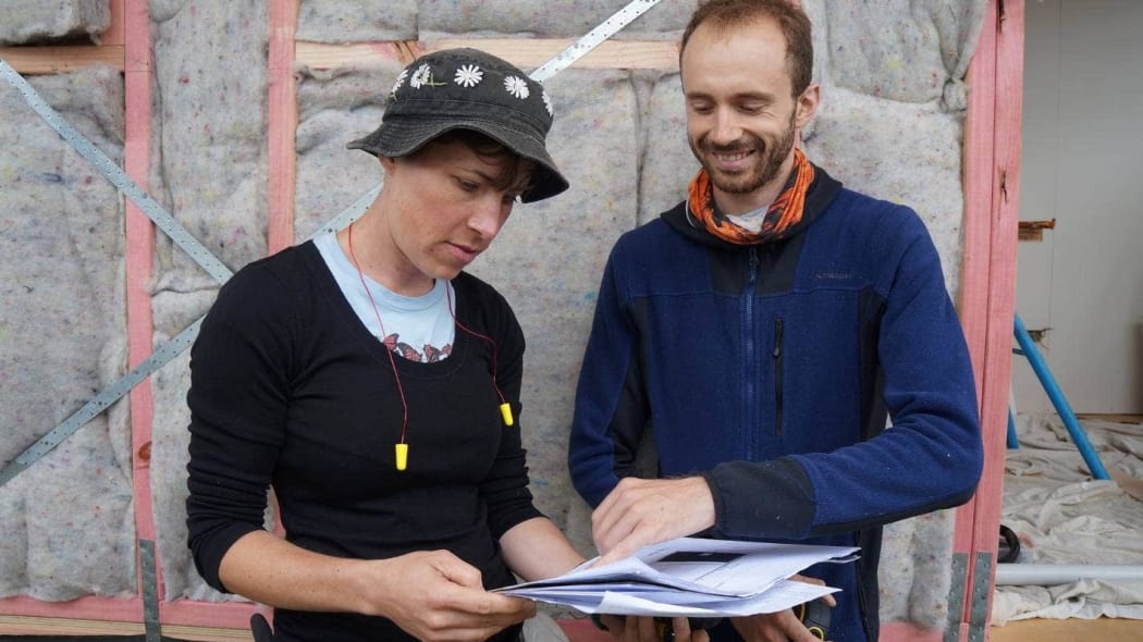 Matthew Lillis (right) with one of the builders of his tiny home