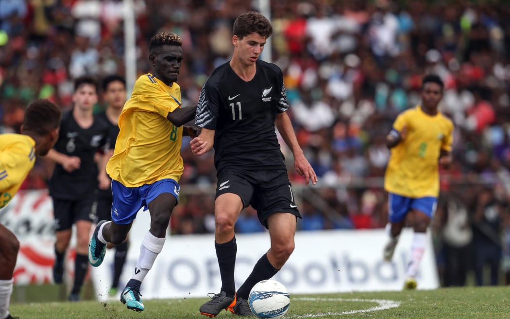 Maxwell Keana closes down New Zealand's Matt Garbett during the OFC Under 16 Championship in 2018.