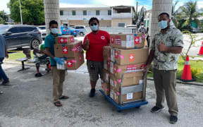 In mid-August, the American Samoa government dispatched hundreds of doses of PaxLovid to help the Marshall Islands with its outbreak. Receiving the donation are Ministry of Health and Human Services and Red Cross representatives.