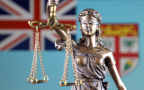 Symbol of law and justice with Fiji Flag. Close up.