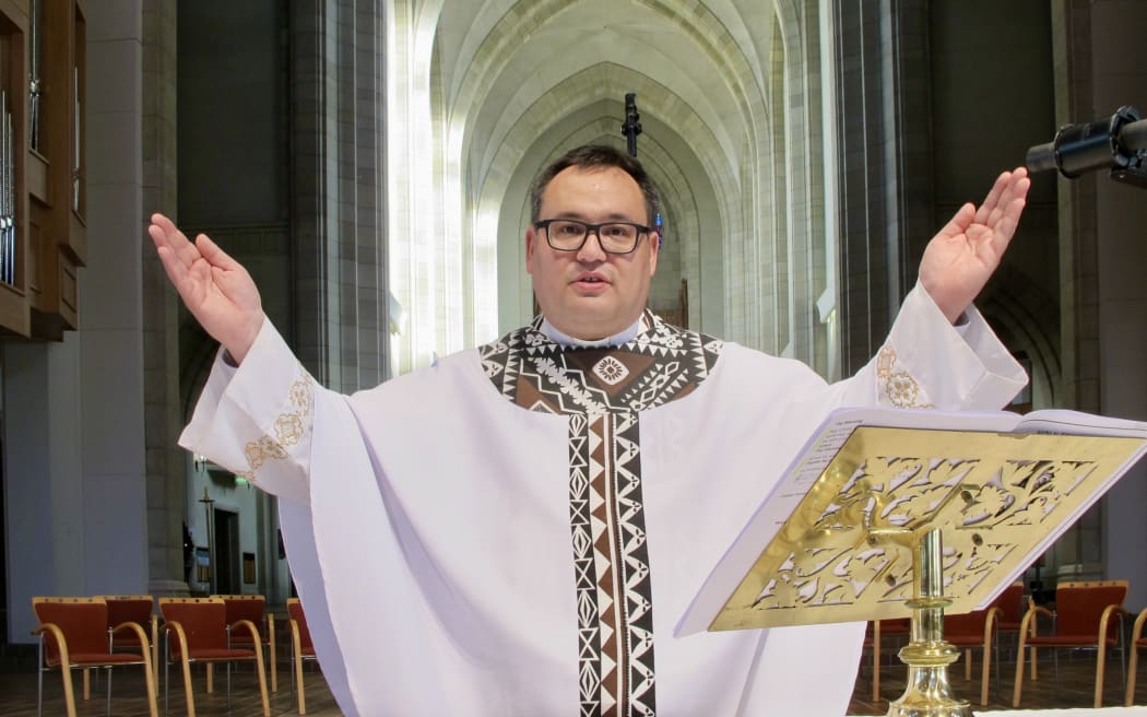 Reverend Ivica Gregurec with hands outstretched