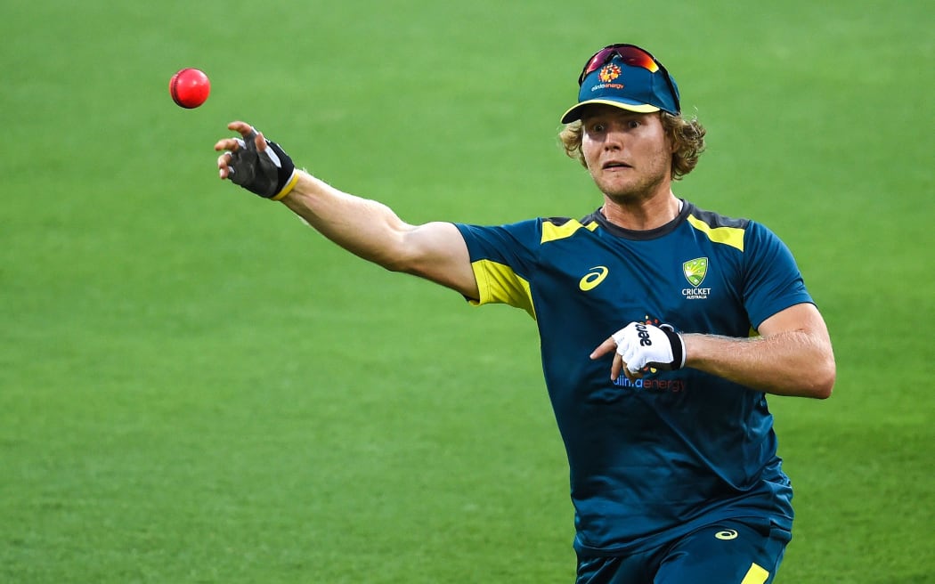 Australia's Will Pucovski throws a ball during a practice session at the Gabba Cricket Ground in Brisbane on January 22, 2019.