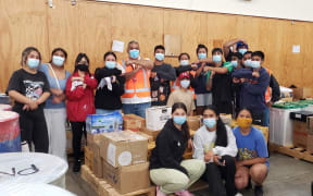 Goods are packed for Tonga by volunteers in Palmerston North.