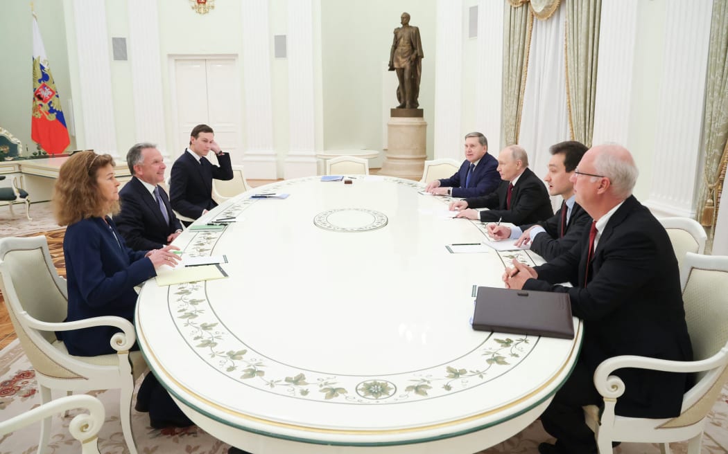 In this pool photograph distributed by the Russian state agency Sputnik, Russia's President Vladimir Putin, accompanied by Kremlin economic envoy Kirill Dmitriev and Kremlin aide Yuri Ushakov, meets with US special envoy Steve Witkoff and US President Donald Trump's son-in-law Jared Kushner at the Kremlin in Moscow on December 2, 2025. (Photo by Alexander KAZAKOV / POOL / AFP)