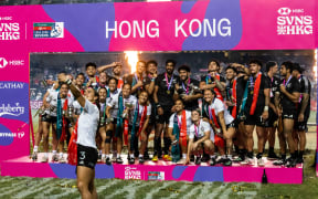 New Zealand men’s and women’s team celebrate after winning their cup final matches at the Hong Kong Sevens rugby tournament.