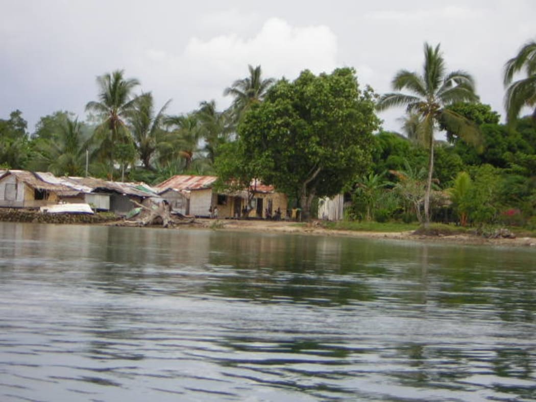 A man in a fishing canoe/boat in Bougainville, Papua New Guinea