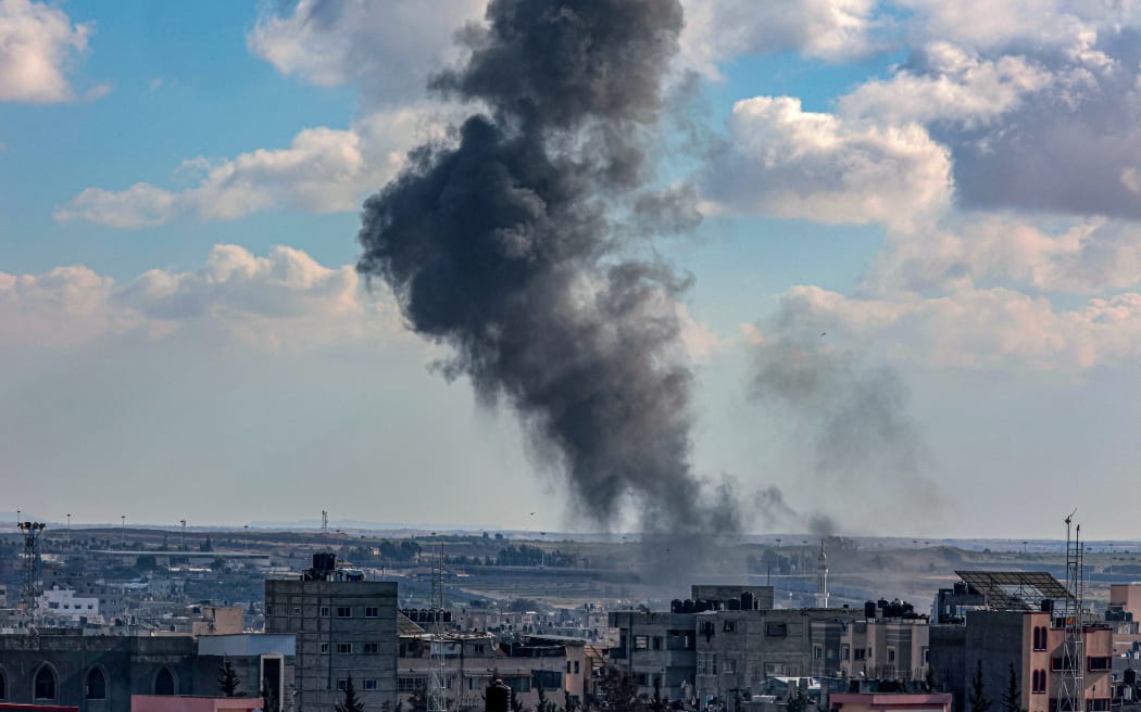 Smoke rises following Israeli bombardment on a position by the border between the Gaza Strip and Egypt in Rafah on February 9, 2024, amid continuing battles between Israel and the Palestinian militant group Hamas. (Photo by SAID KHATIB / AFP)