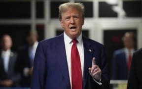 Former US President Donald Trump speaks upon arriving at Manhattan Criminal Court for his trial for allegedly covering up hush money payments linked to extramarital affairs, in New York City, on April 30, 2024. Trump, 77, is accused of falsifying business records to reimburse his lawyer, Michael Cohen, for a $130,000 hush money payment made to porn star Stormy Daniels just days ahead of the 2016 election against Hillary Clinton. (Photo by Seth Wenig / POOL / AFP)