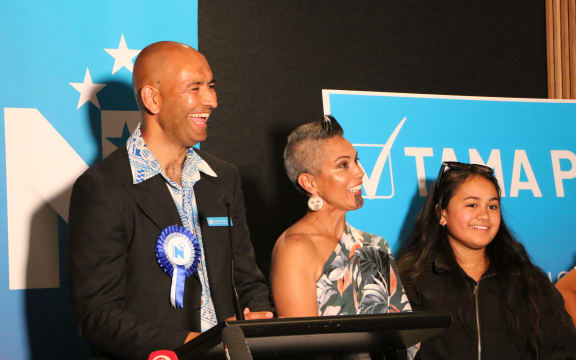Tama Potaka up on stage with his whanau after preliminary votes show he has won the Hamilton West seat by a comfortable margin.