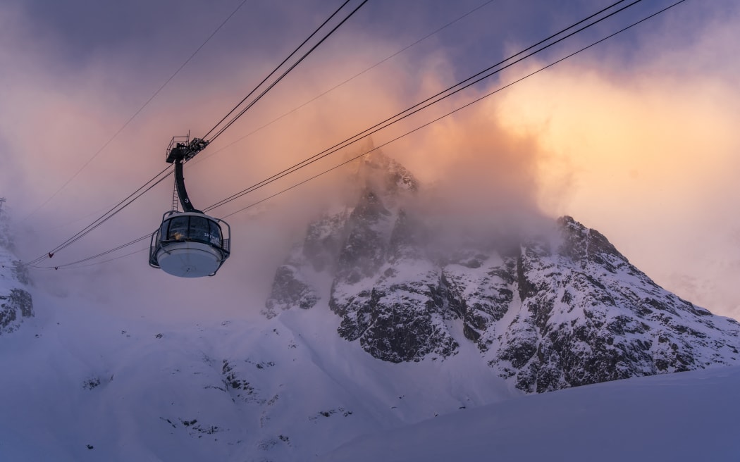 View of snow covered Aosta Valley, mountains and Skyway Monte Bianco cable car in winter, Courmayeur, Aosta Valley, Italian Alps, Italy (Photo by Frank Fell / Robert Harding RF / robertharding via AFP)