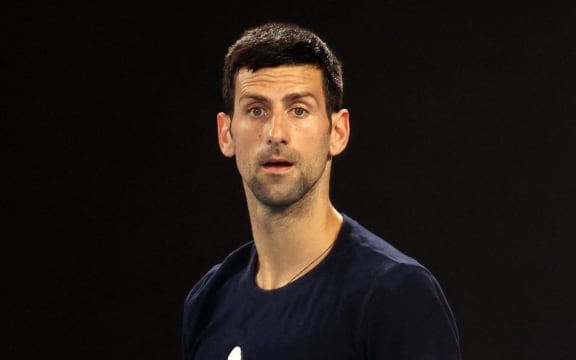 Novak Djokovic of Serbia attends a practice session ahead of the Australian Open tennis tournament in Melbourne on January 14, 2022. (Photo by MARTIN KEEP / AFP) /