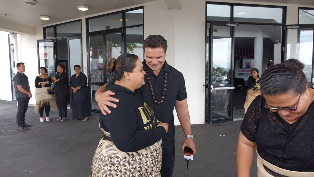 Sione’s sister Paenga Kovi Lauaki being comforted by former All Black great Michael Jones.