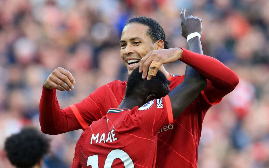 Sadio Mane of Liverpool is congratulated by teammate Virgil van Dijk.