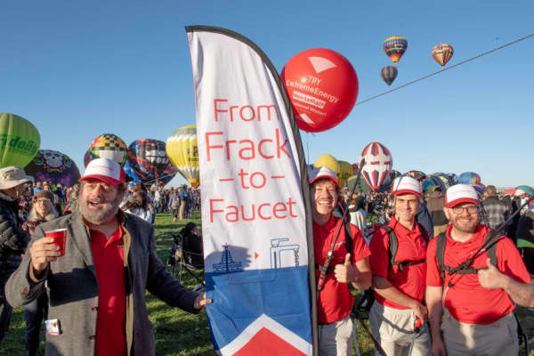 LM Bogad and his fellow protesters dressed up as sales representatives daring visitors to drink ‘produced water' in a protest against the Albuquerque Balloon Fiesta's sponsor Exxon. The protest made headlines for its oddball quality.
