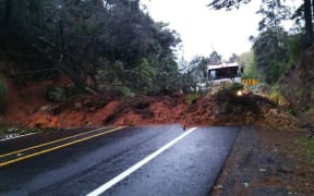 A large slip and fallen trees closed SH1 between Orewa and Warkworth on 12 July 2022.