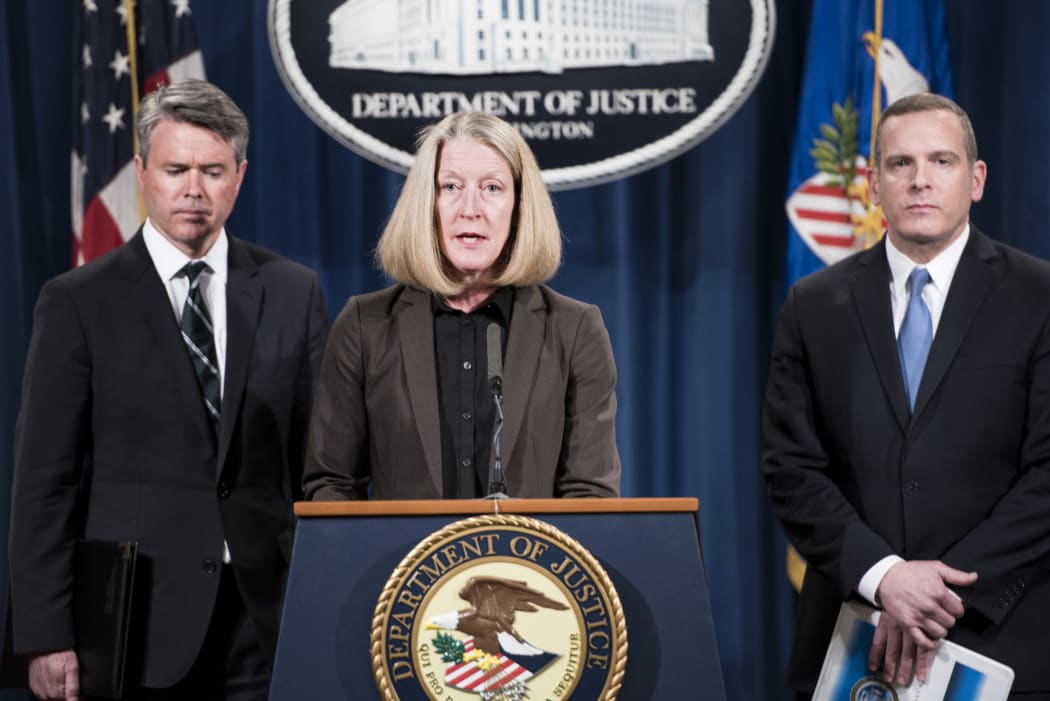 Acting attorney general Mary McCord, centre, announces the indictment, with Attorney for the Northern District of California Brian Stretch, left, and FBI Criminal Cyber, Response ad Services Branch Executive Assistant Director Paul Abbate.