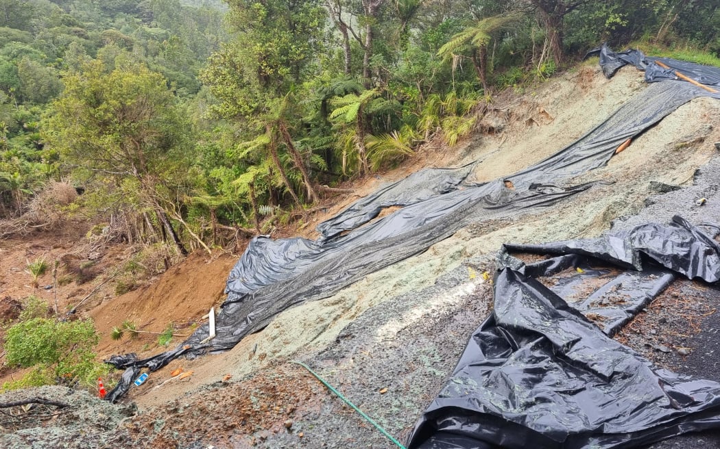 Damage from the January floods on Karekare Road in Karekare, West Auckland on 19 July 2023.