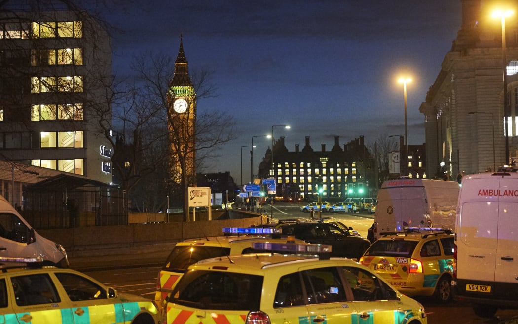 Emergency services in the area around the attack as night falls in London.