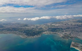 US Air Station Futenma (L) and Kadena Air Base can be seen in an aerial view of central Okinawa Island.
