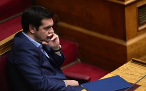 Greek Prime Minister Alexis Tsipras listens to speakers in Parliament on 23 July 2015.