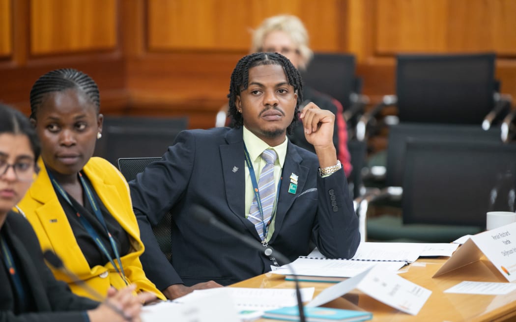 CYP delegate listens in during a committee session