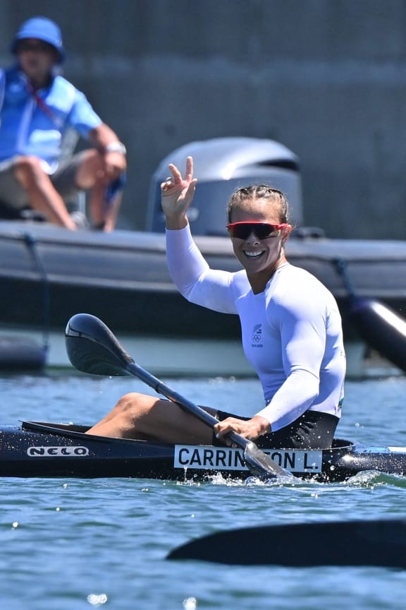 Lisa Carrington celebrates after winning gold in the women's kayak single 500m final