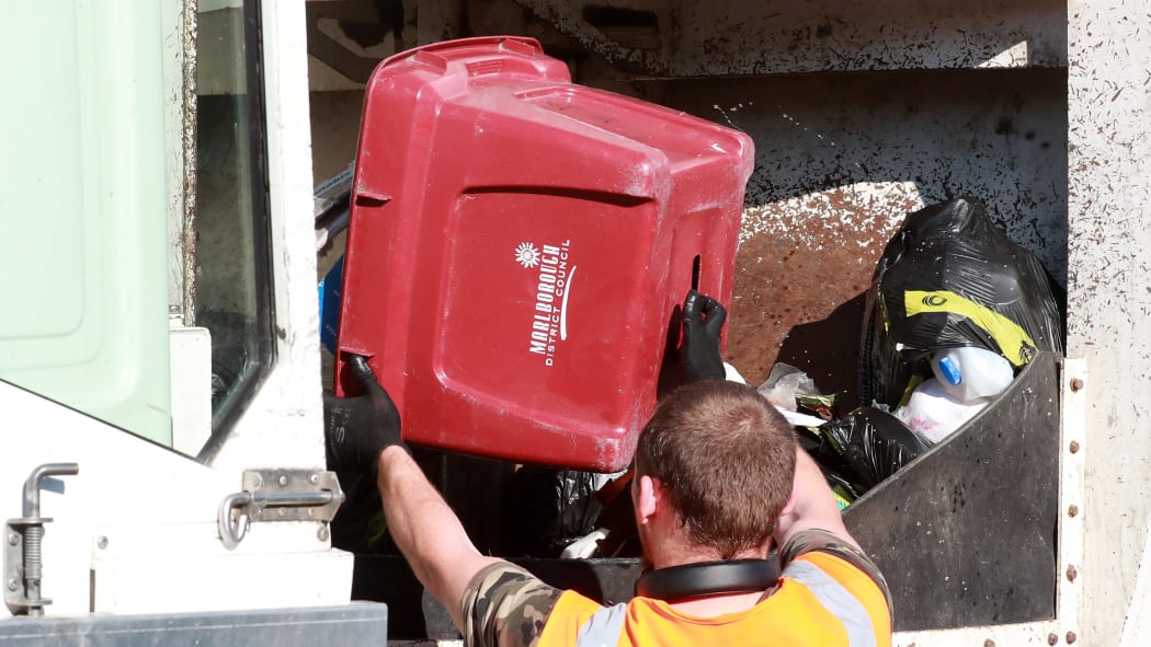 Kerbside rubbish and general waste from Blenheim is tipped into the back of a collection truck.