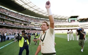 In this file photograph taken on December 28, 2006, Australian spinner Shane Warne waves to the crowd after playing his last Test Match on his home ground, the MCG, on the third day of the fourth cricket Test played in Melbourne.