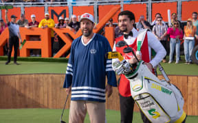 Adam Sandler as Happy Gilmore and Benito Antonio Martínez Ocasio as Oscar Mejias in Happy Gilmore 2
