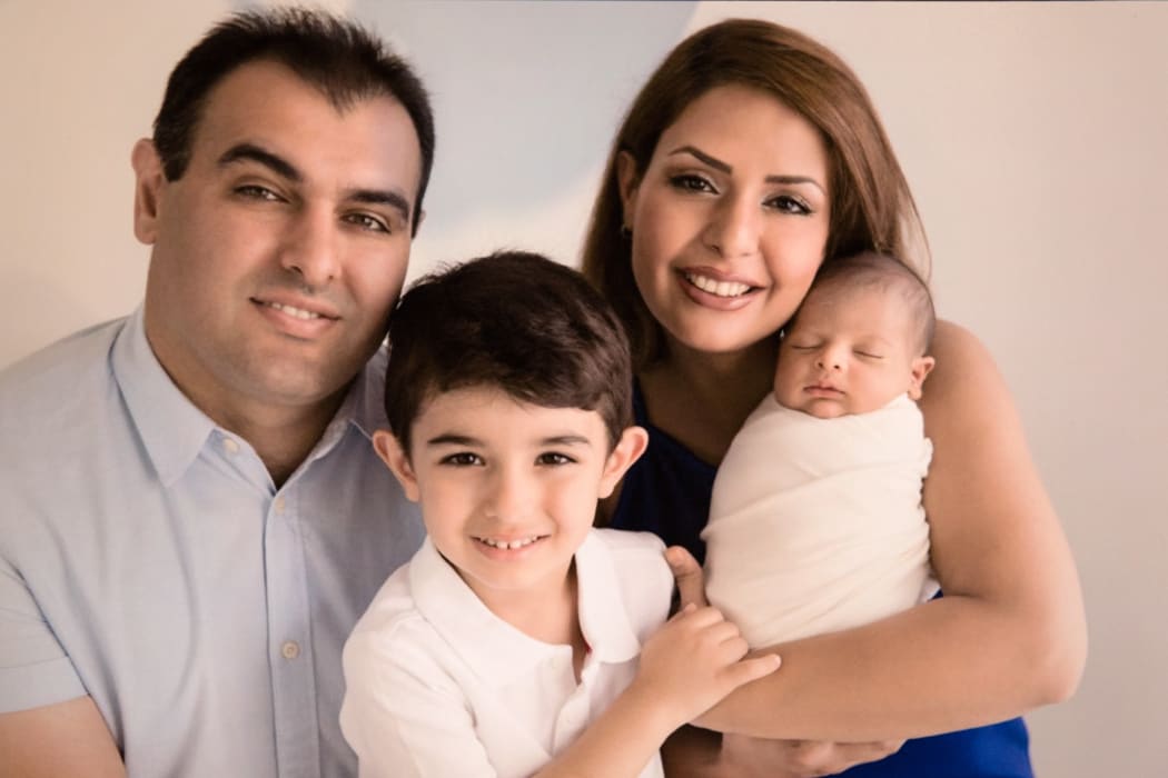 A family picture showing father Siamak, mother Mohadeseh and their son's Arteen (centre) and Radeen (right) before the crash last Easter weekend which killed both Arteen and Radeen.