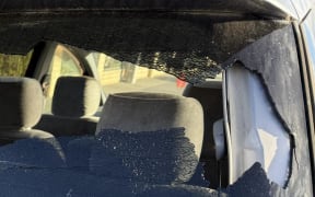 The damage to MP Matt Doocey's car, that he says appears to have been done by someone throwing a rock through the window.