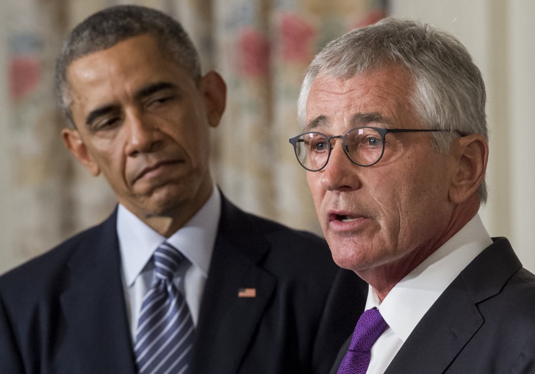 Chuck Hagel (right) announcing his resignation alongside US President Barack Obama.