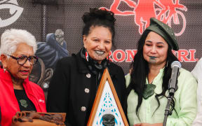 Heather Te Au-Skipworth (right) passes the mauri of IronMāori to Waylyn Tahuri-Whaipakanga (centre) CE of Te Taiwhenua o Heretaunga.