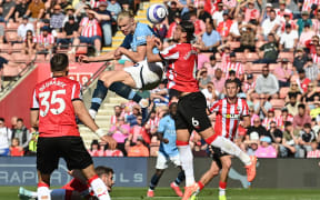 Manchester City's Erling Haaland challenges for possession against Southampton.
