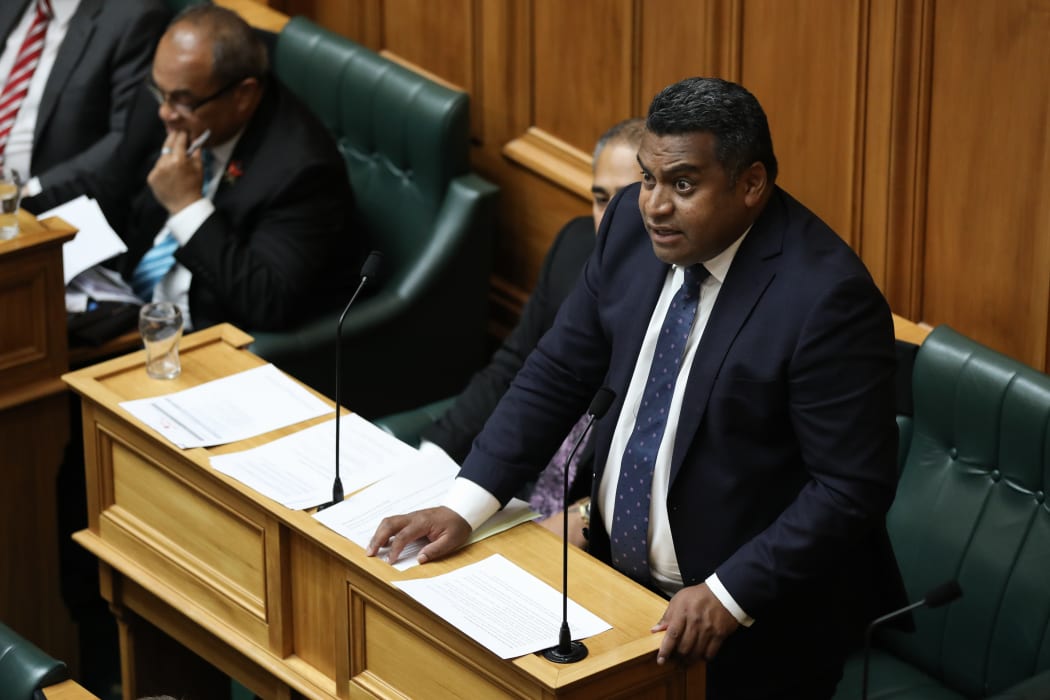 Kris Faafoi answering a question in the House