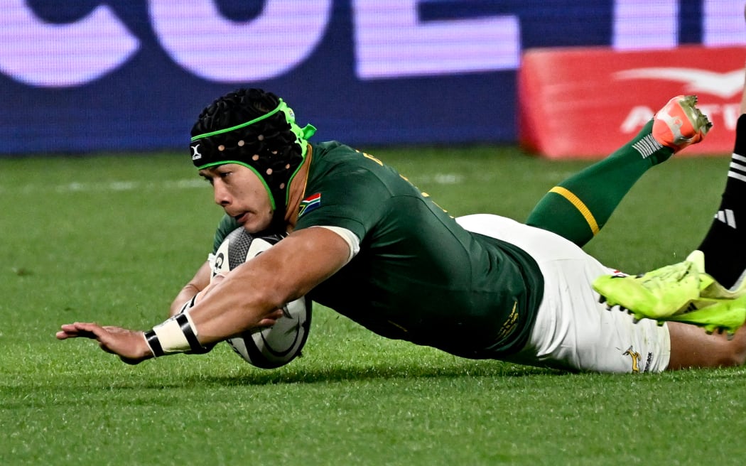 Cheslin Kolbe of South Africa dives over to score a try.
