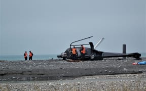 Crash inspectors at the scene of the fatal helicopter accident.