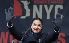 U.S. Rep. Alexandria Ocasio-Cortez, D-New York, waves to the crowd after speaking at Women's Unity Rally organized by Women's March NYC at Foley Square in Lower Manhattan in New York. (AP Photo/Kathy Willens, File)
