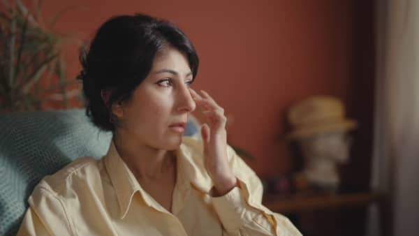 Shamin Yazdani wipes her tears as she speaks to a close friend online about freezing her eggs.