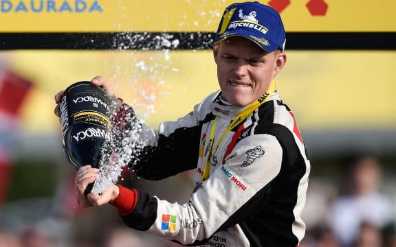 Estonian driver Ott Tanak celebrates with champagne on the podium as he won the 2019 FIA World Rally Championship after finishing second on the 55th Catalonia 2019 FIA World Rally Championship on October 27, 2019 in Salou, near Tarragona.