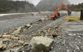 Work under way in June at the southern approach to the Waiho River Bridge at Franz Josef to add rock rip rap protection.
