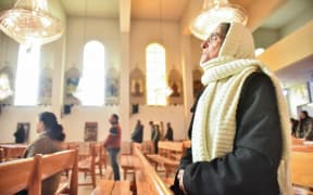 Worshippers attend Sunday Mass at a church in the village of Maalula north of the Syrian capital Damascus on 15 December, 2024.