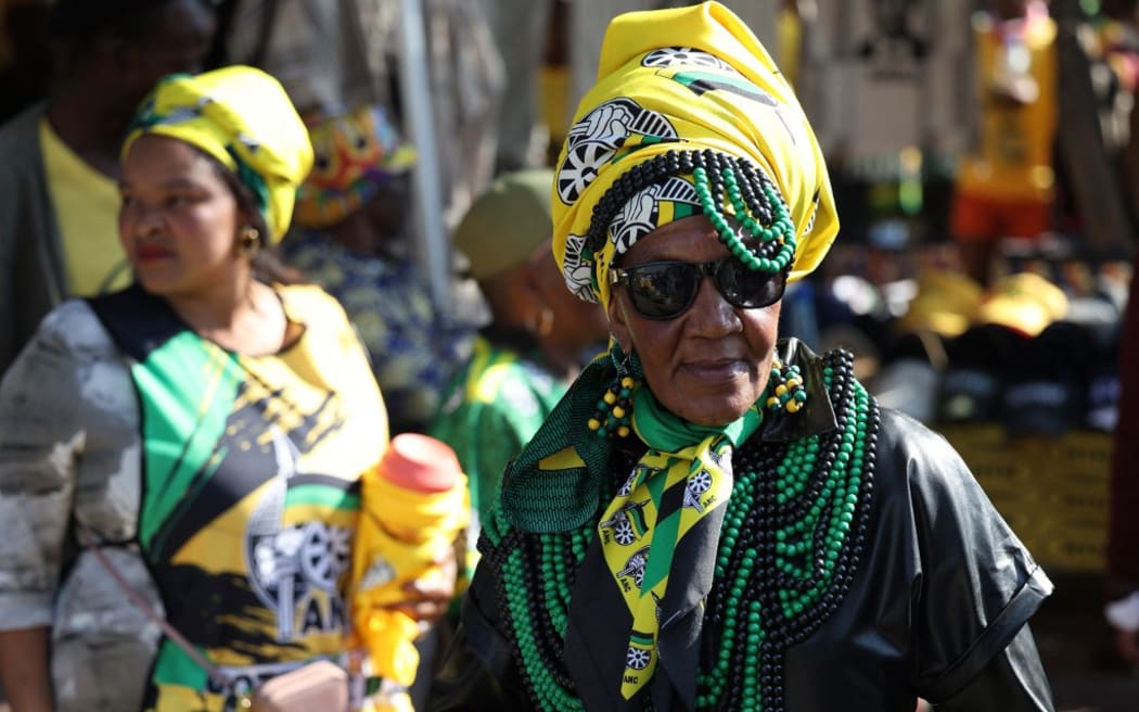 A supporter of the African National Congress (ANC) looks on as they wait for their President Cyril Ramaphosa (not in picture) during the party’s “Democracy Big Walk” in Soweto on May 24, 2024 ahead of the countries upcoming national and provincial elections on May 29, 2024. (Photo by Phill Magakoe / AFP)