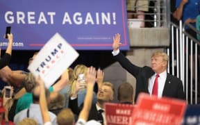 US President Donald Trump greets supporters after speaking during a campaign rally  on June 20, 2018 in Minnesota.