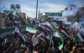 Syrians mark the 13th anniversary of the uprising against the Bashar al-Assad regime in the rebel-held city of Azaz, northwestern Syria, on 15 March, 2024.