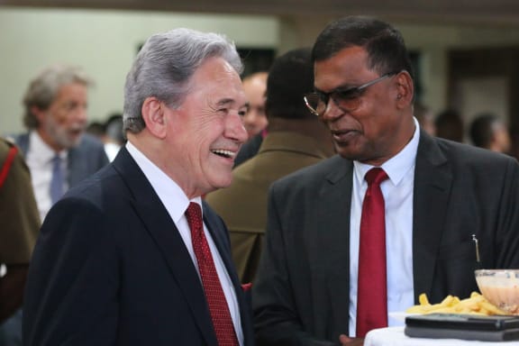 NZ deputy prime minister and foreign minister Winston Peters shares a moment of levity with Fijian deputy prime minster and minister of finance Biman Prasad at a cocktail function in Suva on 16 December, 2023.