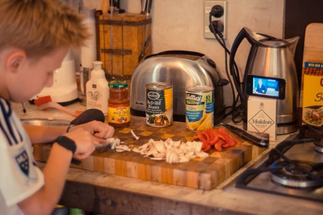 @CharlieLeComte is shown on Twitter with the hashtag #cookingwithjohn, making Chicken Tacos while watching @CheckpointRNZ @JohnJCampbell