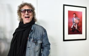 British photographer Mick Rock poses for a photograph during his 2016 exhibition "Life on Mars", on David Bowie's Ziggy Stardust years, at the "Le Multiple" exhibition hall in Toulouse.